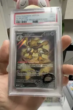 2025 POKEMON MEGA EVOLUTION POKEMON CENTER ETB PROMO #009 ALAKAZAM PSA 9 - Image 2