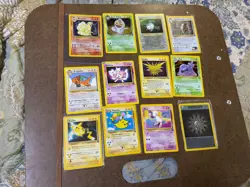 12 Vintage Pokemon cards - 7 Holofoil Ninetails Dark Arbok Muk plus 5 Promos - Image 1