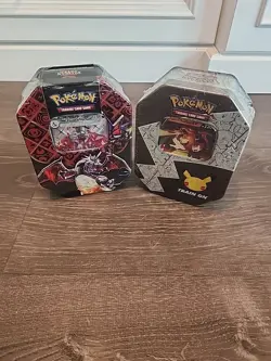 Pokemon Charizard (2 )- 4 Pack Tins Celebrations & Paldean Fates - New - Sealed - Image 1