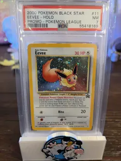 PSA 7 NM Pokemon 2000 Black Star Eevee #11 Holo Pokemon League Promo - Image 1