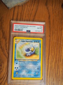 Pokemon 2002 1st Edition Neo Destiny Light Vaporeon card, PSA 8 - Image 1
