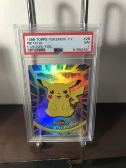 1999 Topps Pokemon TV #25 Pikachu Rainbow Foil Blue Logo PSA 7 Low Pop - Image 1