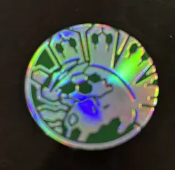 OFFICIAL POKEMON TCG PLASTIC SILVER HOLOFOIL Zygarde COIN - Image 1