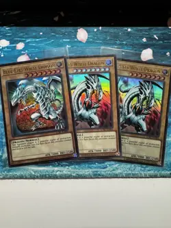 Yugioh! Blue-Eyes White Dragon (Version 1&3) LCKC-EN001 Ultra Rare Near Mint (3) - Image 1