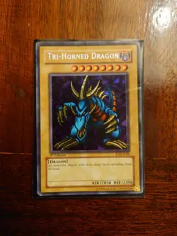 Yu-Gi-Oh Tri-horned Dragon LOB-E000 1st Edition Secret rare HP - Image 1