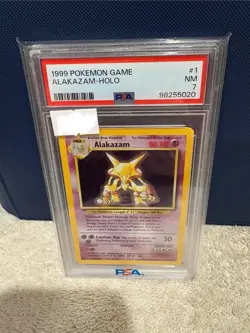 1999 Pokemon Game Unlimited Base Set Alakazam Holo 1/102 PSA 7 - Image 1