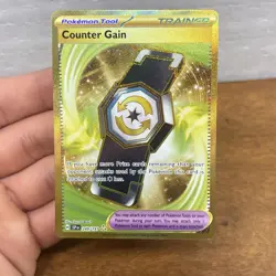 Pokemon TCG Counter Gain 249/191 Surging Sparks Hyper Rare Gold Trainer - Image 1