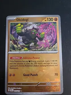 Okidogi (Master Ball Pattern) - 057/131 - Prismatic Evolutions Pokemon Holo NM - Image 1