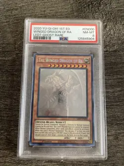 Yugioh The Winged Dragon of Ra LED7-EN000 1st Edition Ghost Rare PSA 8 NM-MT - Image 1