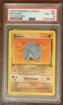 PSA 8 Rhyhorn #61 1st Edition Pokemon 1999 Jungle Set Near Mint - Mint - Image 1