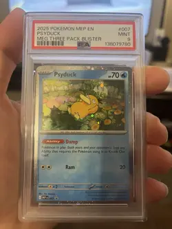 2025 POKEMON MEP EN-ME BLACK STAR PROMO 007 PSYDUCK PSA 9 (Swirl Above Head) - Image 1