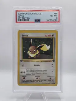 EEVEE 1ST EDITION 2000 Pokemon Team Rocket PSA 8 - Image 1