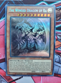 The Winged Dragon of Ra Ghost Rare LED7-EN000 Near-Mint 1st Ed Yugioh - Image 1