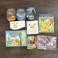 Pokemon Tins, Giant Cards, Celebrations Game, And Books - Image 1