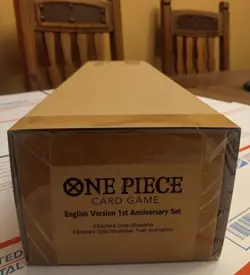 One Piece TCG 1st Anniversary Set - English Version FACTORY SEALED, Small Dent - Image 1