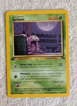 Pokemon Grimer 48/62 1st Edition Fossil Regular LP-NM - Image 1