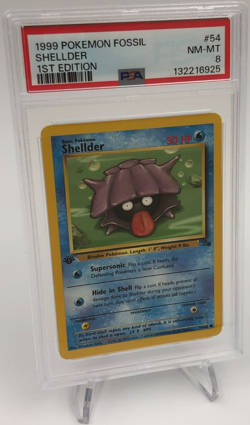 1999 POKEMON FOSSIL Trading Card SHELLDER #54/62 1ST EDITION graded slab PSA 8 - Image 1