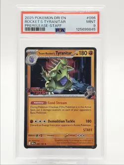 ROCKET'S TYRANITAR 2025 POKEMON RIVALS PRERELEASE STAFF 096/182 PSA 9 Q0004 - Image 1