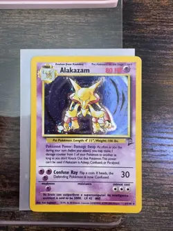 Pokemon TCG Alakazam 1/130 Pokemon Base Set 2 Ear SWIRL 🌀Holo Rare Card WOTC:LP - Image 1