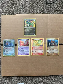 Pokemon Stamped Holo Rayquaza, Starmie, Lickitung, Numel & Kabutops Card Lot - Image 1