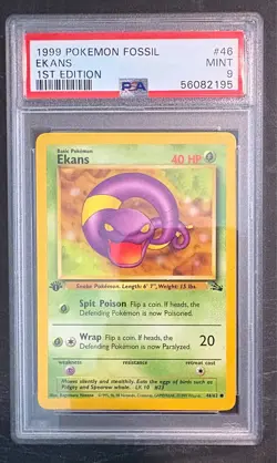 1999 Pokemon Fossil 1st Edition 46 Ekans PSA 9 - Image 1