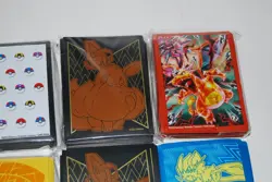 Collection Lot of 11 Pokemon Sleeves Charizard, Pikachu, Eevee, Team-Up and More - Image 3