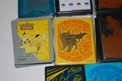 Collection Lot of 11 Pokemon Sleeves Charizard, Pikachu, Eevee, Team-Up and More - Image 4