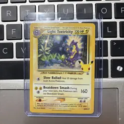 POKEMON CELEBRATIONS LIGHT TOXTRICITY COSMOS HOLO SWSH137 NM CONDITION - Image 1