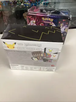 Pokemon Lot Of 3 Box ETB Celebrations ( Vaporeon tin ) Treasure Chest New Sealed - Image 5