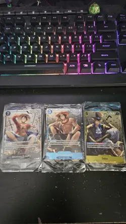 One Piece TCG Monkey D. Luffy, Portgas D. Ace, Sabo Tin Promo Lot - Image 1