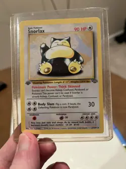 Pokemon Snorlax 27/64 Base Set 1st Edition w/ Top Loader - Image 1