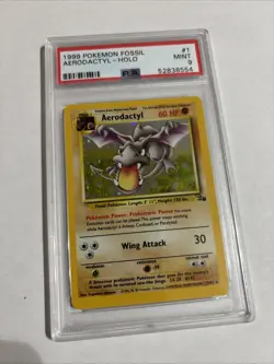 1999 Pokemon Fossil Aerodactyl Holo #1 – PSA 9 MINT – WOTC Vintage - Image 1