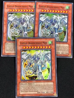 YUGIOH STARDUST DRAGON/ ASSAULT MODE DP09-EN001 1ST SUPER X3 (NM) - Image 1