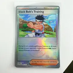 Black Belt's Training (Poke Ball) - 097/131 - Pokemon Prismatic Evolutions NM - Image 1