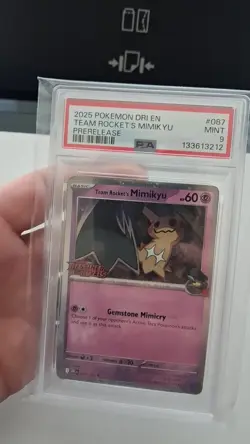 PSA 9 2025 Pokemon DRI EN Team Rocket's Mimikyu Prerelease Cosmos Holo Foil - Image 2