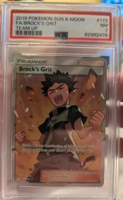 2019 POKEMON SUN & MOON TEAM UP #172 FULL ART/BROCK'S GRIT PSA 7 - Image 1