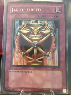 Yu-Gi-Oh! - Jar of Greed LON-047 Trap Card Labyrinth Of Nightmare - Image 1
