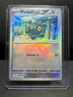 Bronzor 066/131 Reverse Holo Master Ball Pokemon Prismatic Evolutions NM - Image 1