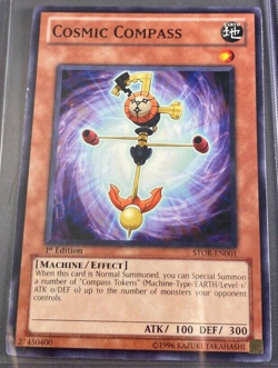 YuGiOh Cosmic Compass - STOR-EN001 - Common - 1st Edition Near Mint - Image 1