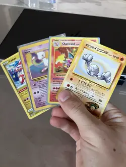 Charizard-Mew-Geodude-Latias Pokemon Cards, 2016 Charizard, First Edition Mew - Image 1
