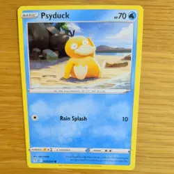 PSYDUCK 024/203 POKEMON CARD (EVOLVING SKIES SET) - Image 1