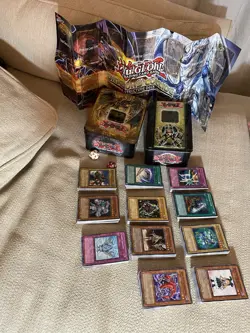 YUGIOH cards Bulk Lot 500 Cards + 2 Tins & Dice + Paper Mat/Poster - Image 1