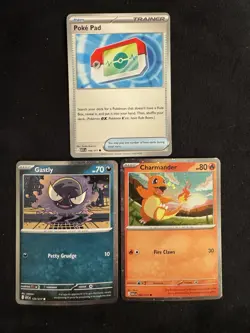 Pokemon Ascended Heroes - Pokepad 198/217, Charmander And Gastly Cosmos Holos - Image 1