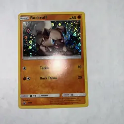 2016-19 Pokemon Gaming SM Black Star Promos Rockruff #SM06 Holo - Image 1