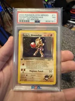 2000 POKEMON GYM HEROES HOLO-1ST EDITION #11 ROCKET'S HITMONCHAN PSA 7 - Image 1