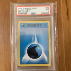 1999 Pokemon GAME 1st Edition Water Energy #102 PSA 7 - Image 1