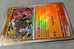 Pokemon TCG, Okidogi (Master Ball Pattern) 057/131 Sv: Prismatic Evolutions Holo - Image 1