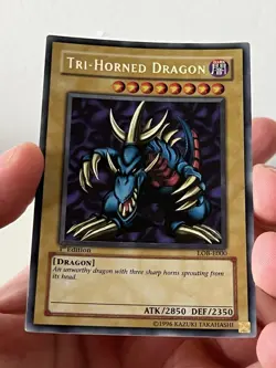Tri-Horned Dragon LOB-E000 Secret Rare 1st Edition Yu-Gi-Oh Mint+ - Image 1