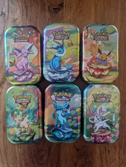 Pokemon Prismatic Evolutions Tin Card And Coin (NO Trading Cards) - Image 1