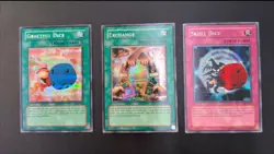 Yu-Gi-Oh! EDS Prismatic Secret Rare Promo Exchange, Graceful Dice, Skull Dice - Image 1